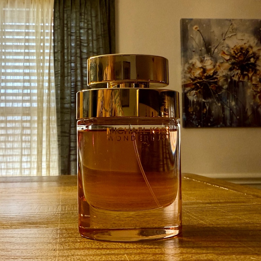 Michael Kors Wonderlust Perfume. 3.4oz. Barley used.
